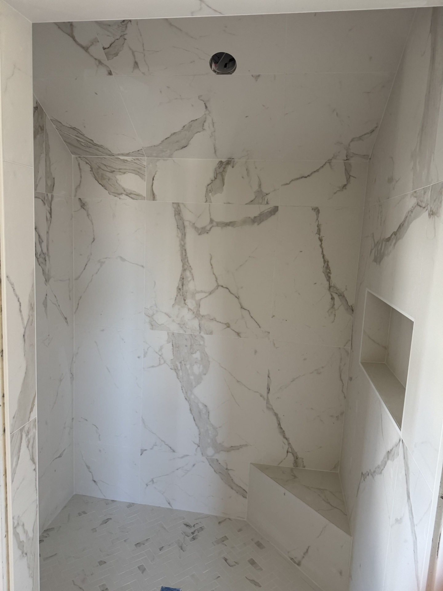 Floor to ceiling tiled shower